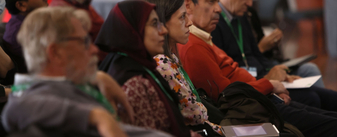 A row of mathematicians sitting in a lecture theathre